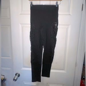 Bebe black leggings with unique pattern down the legs size xs